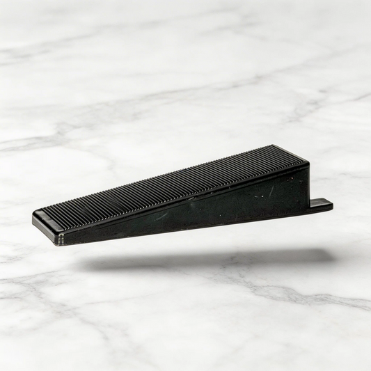 Oskita Civiplas tile leveling wedge on marble background