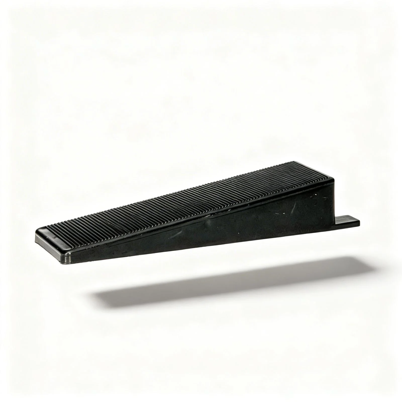 Oskita Civiplas tile leveling wedge on white background